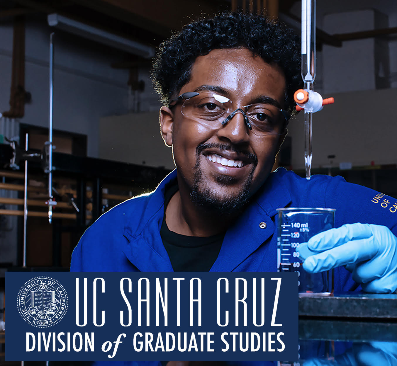 A smiling person in a chemistry lab.